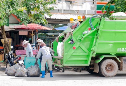 Safety officer conducting a site risk assessment for rubbish removal