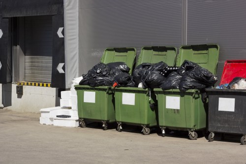 Workers sorting materials at a commercial recycling facility